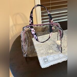 Clear stadium purse with purple floral trim